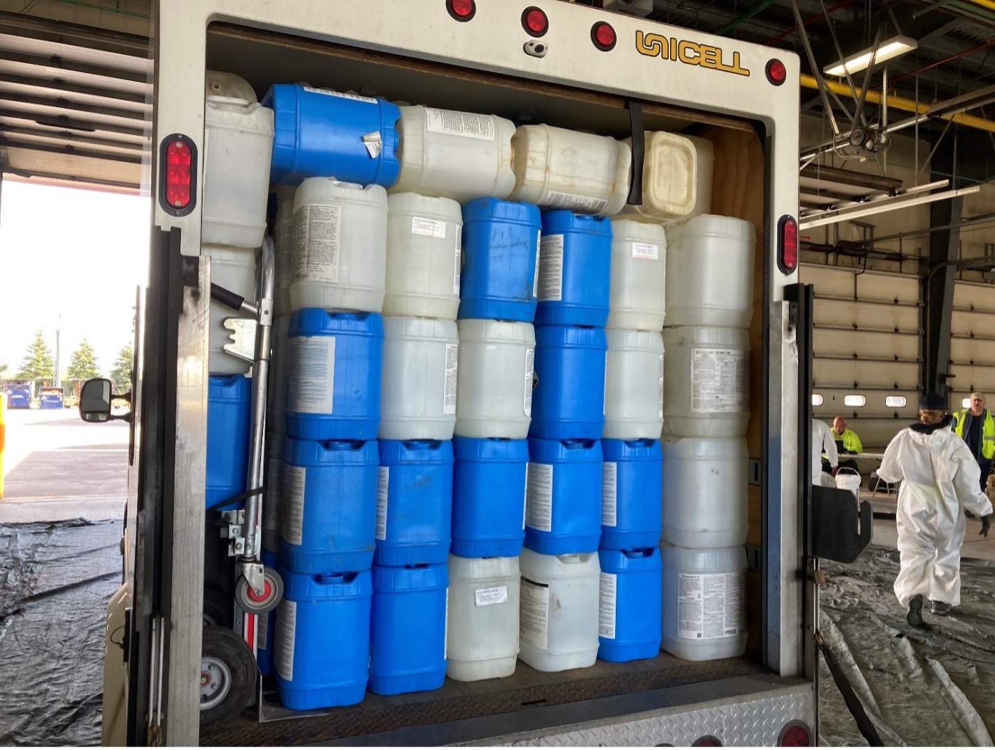 Large quantity of triple-rinsed biocide containers for recycling.